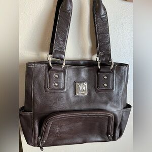 Real brown leather Tignanello handbag. Used a few times. Perfect condition.